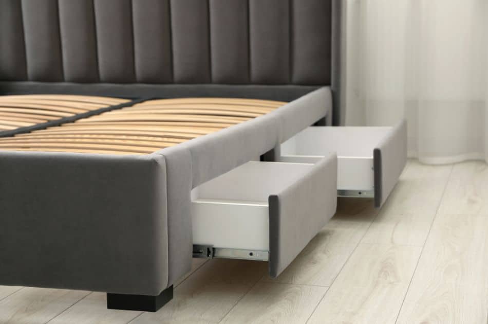 A bed with built-in drawers for convenient storage.